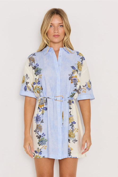 Woman wearing a floral dress with a white background