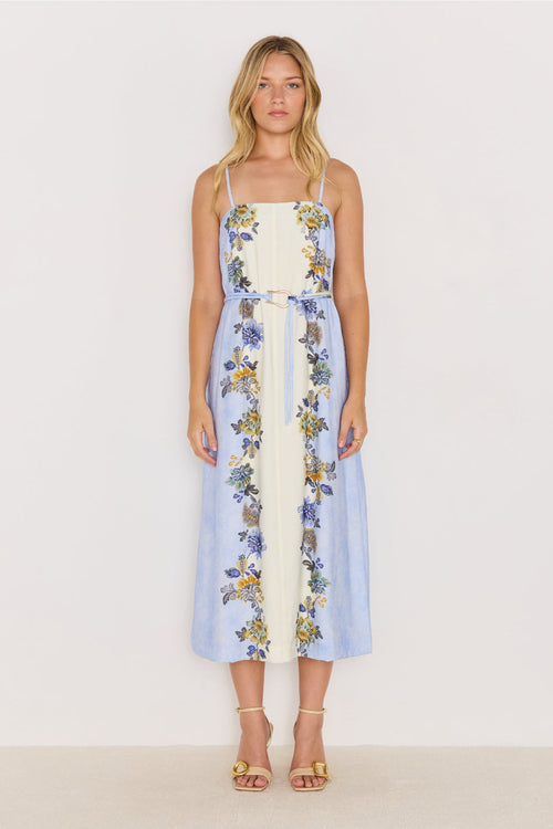 Woman wearing a floral dress with a white background