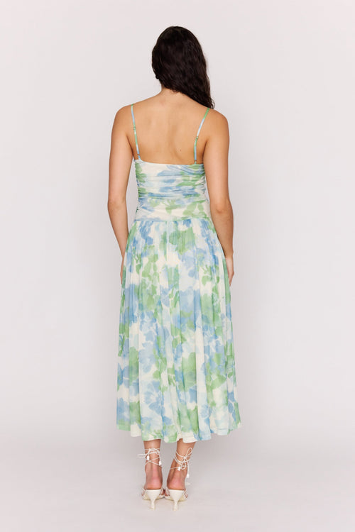 Woman wearing a floral dress with a white background