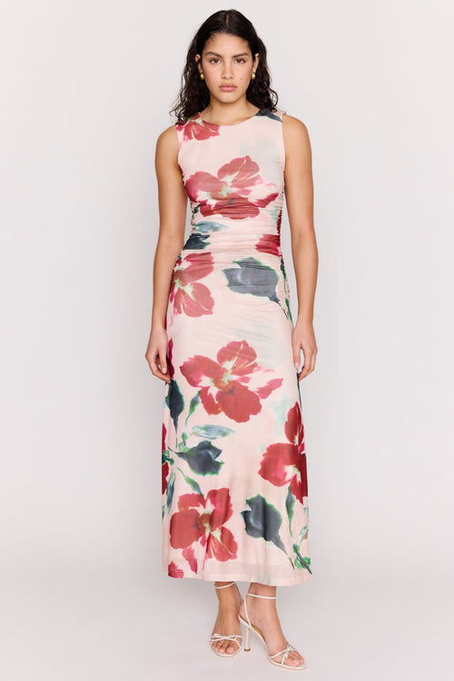 Woman wearing a floral dress on a white background