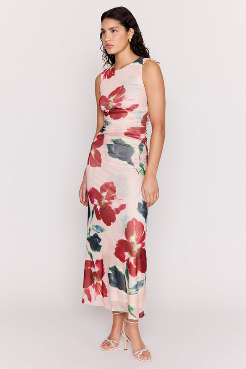 Woman wearing a floral dress on a white background