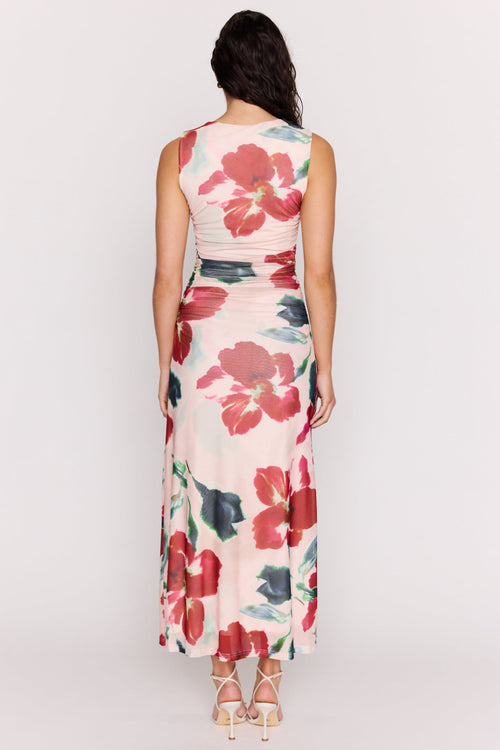 Woman wearing a floral dress on a white background