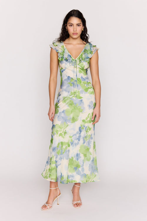 Woman wearing a floral dress on a white background