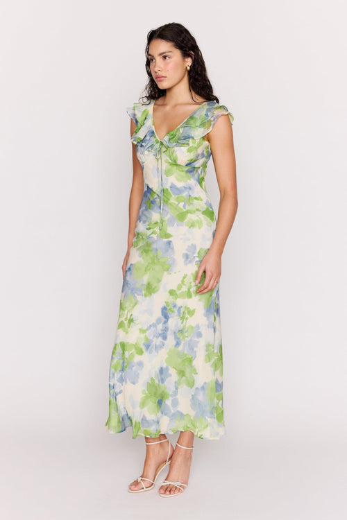 Woman wearing a floral dress on a white background
