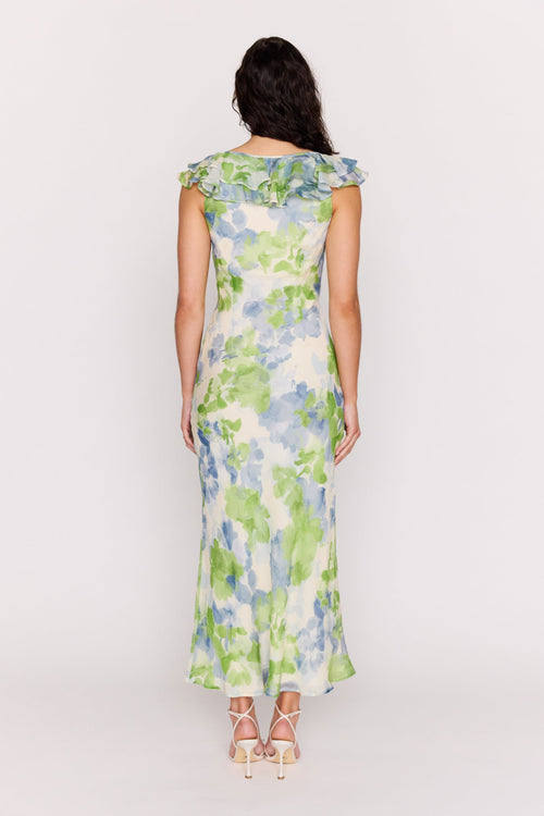 Woman wearing a floral dress on a white background