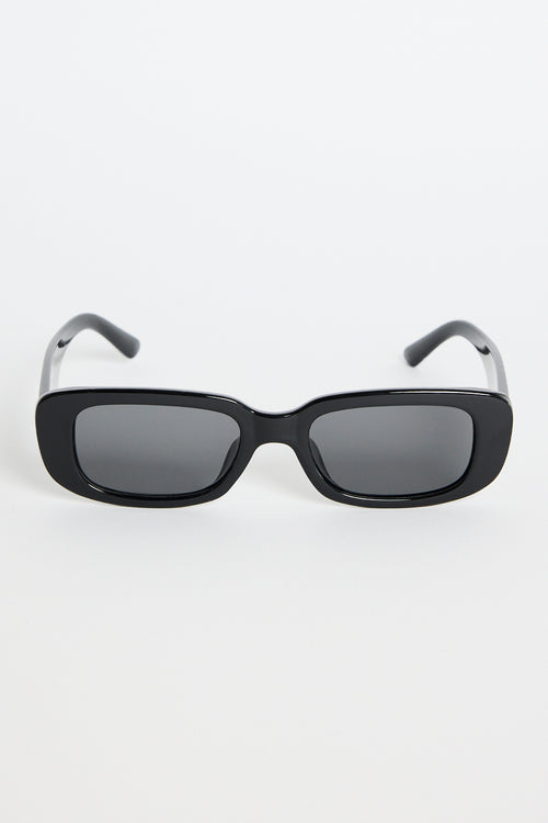 Glossy black rectangular sunglasses with dark tinted lenses, photographed on a white background.