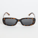 Rectangular brown tortoiseshell sunglasses with dark tinted lenses, photographed on a white background