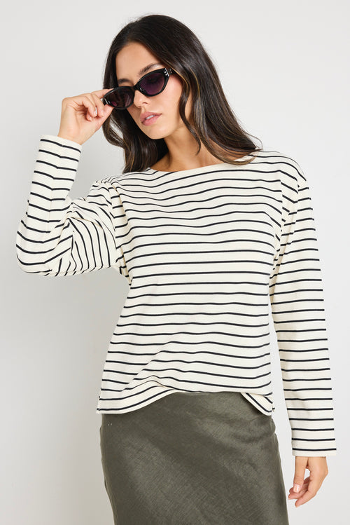 model wears stripe long sleeve black and white boat neck tee 