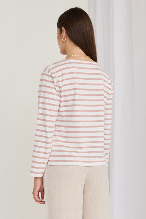 Model wears a white and pink stripe shirt