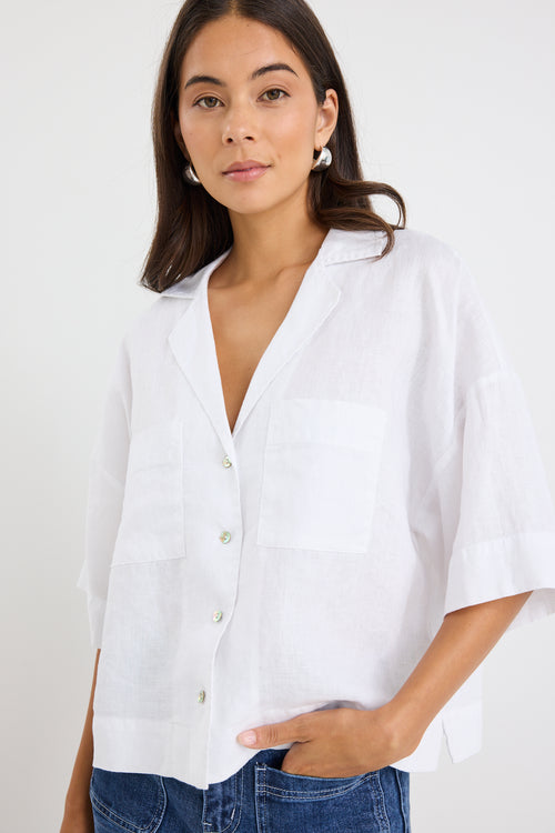 model wears a white linen boxy button up shirt