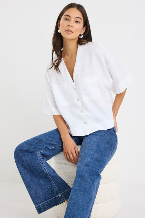 model wears a white linen boxy button up shirt