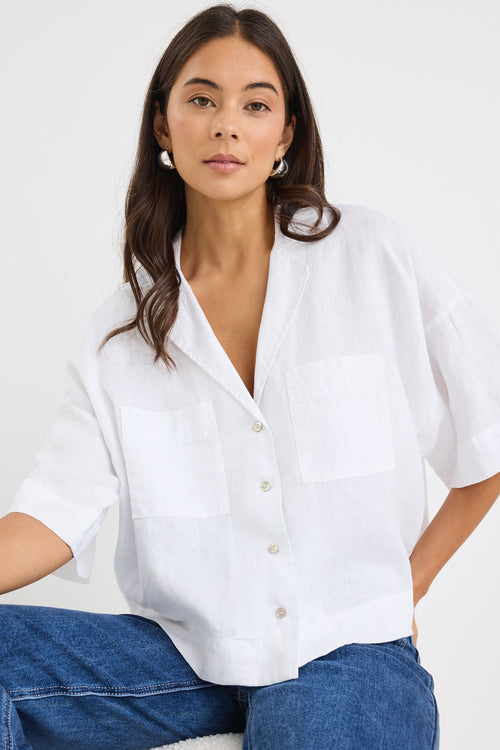 model wears a white linen boxy button up shirt