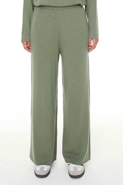 Model wears green lounge pants