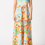 model wears a colourful thin strap maxi dress