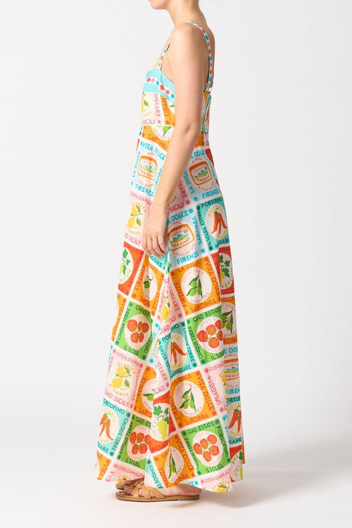 model wears a colourful thin strap maxi dress