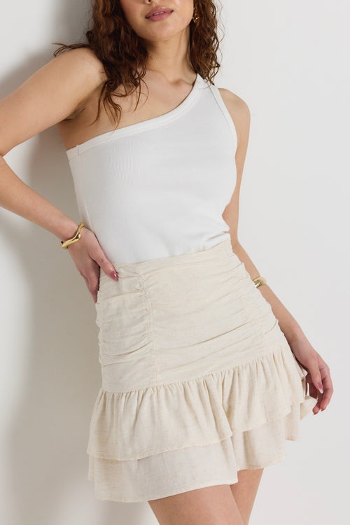 model wears a natural linen mini skirt