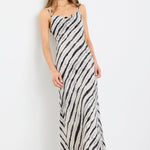 Woman wearing a zebra-striped dress on a white background