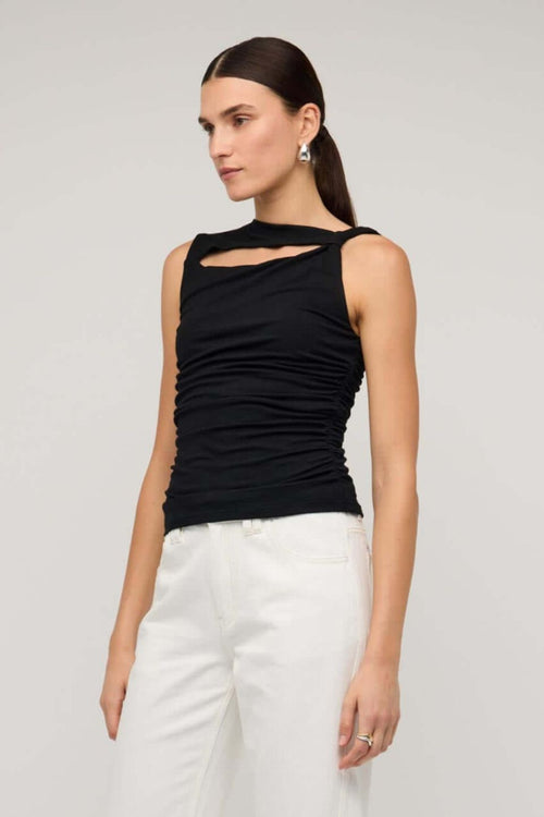 Black sleeveless top with asymmetric neckline and cutout detail, featuring a ruched body for a fitted silhouette, worn by a model against a neutral background.