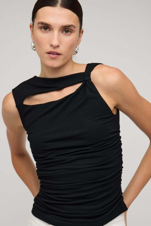 Black sleeveless top with asymmetric neckline and cutout detail, featuring a ruched body for a fitted silhouette, worn by a model against a neutral background.