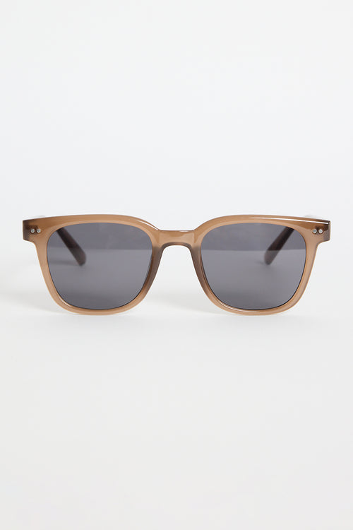 Translucent brown classic square sunglasses with dark tinted lenses, photographed on a white background.