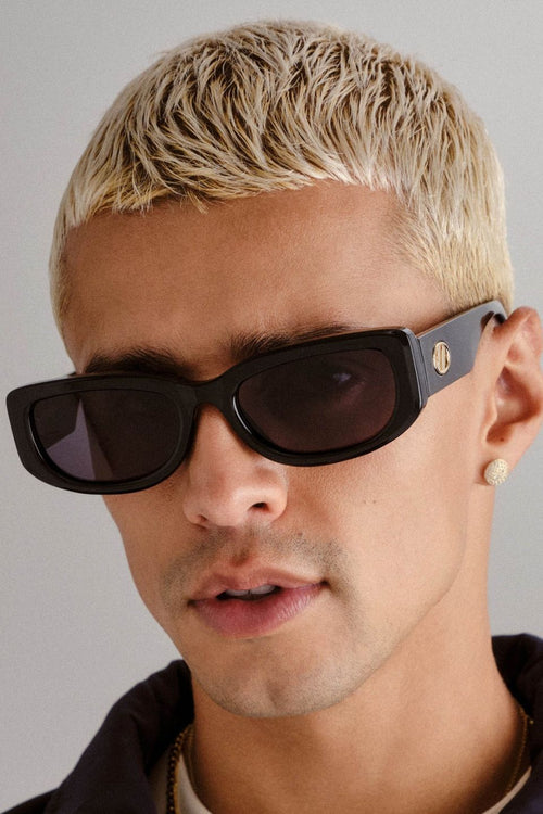 Black rectangular sunglasses with narrow frames and khaki-tinted mono lenses.