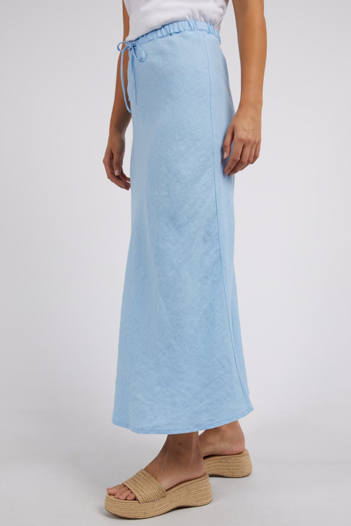 model wears blue linen maxi skirt