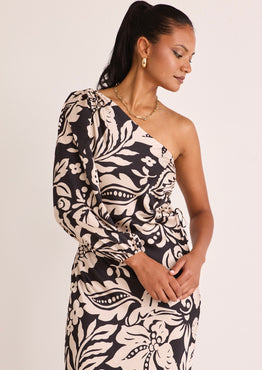 model wears a one shoulder black floral midi dress