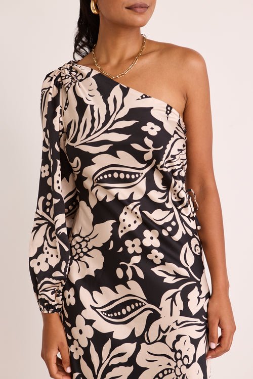 model wears a one shoulder black floral midi dress