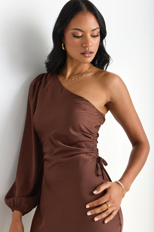 model wears a brown one shoulder midi dress