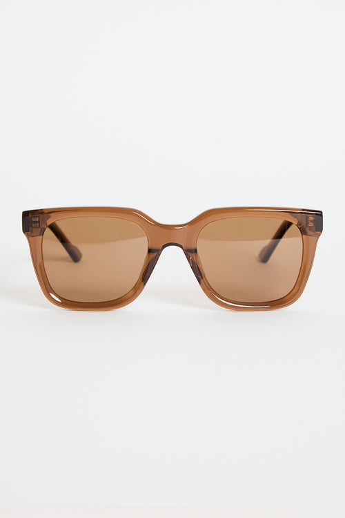Espresso-brown rounded-square sunglasses with warm brown tinted lenses, photographed on a white background.