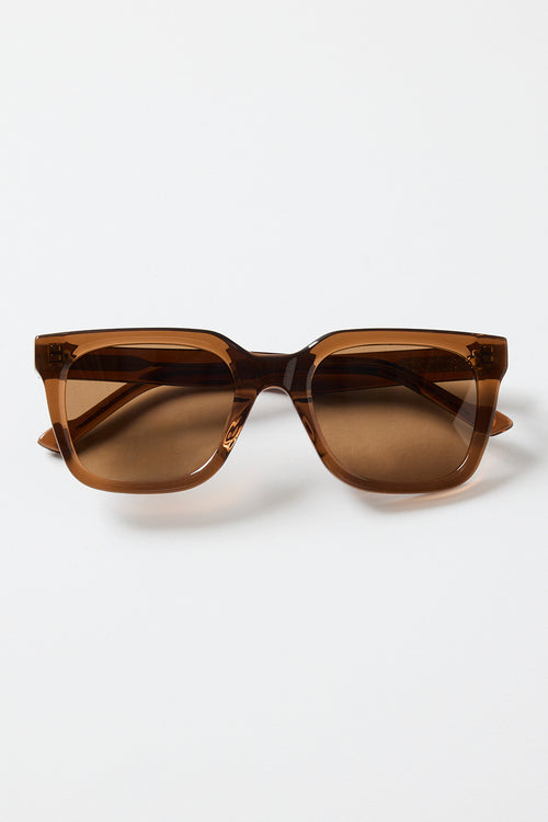 Espresso-brown rounded-square sunglasses with warm brown tinted lenses, photographed on a white background.