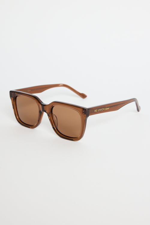 Espresso-brown rounded-square sunglasses with warm brown tinted lenses, photographed on a white background.