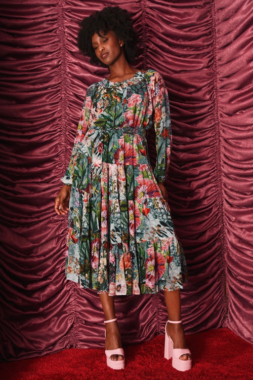 Model wears a floral midi dress