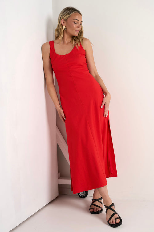 model wears a red linen maxi dress