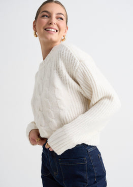 model wears a white knit jumper