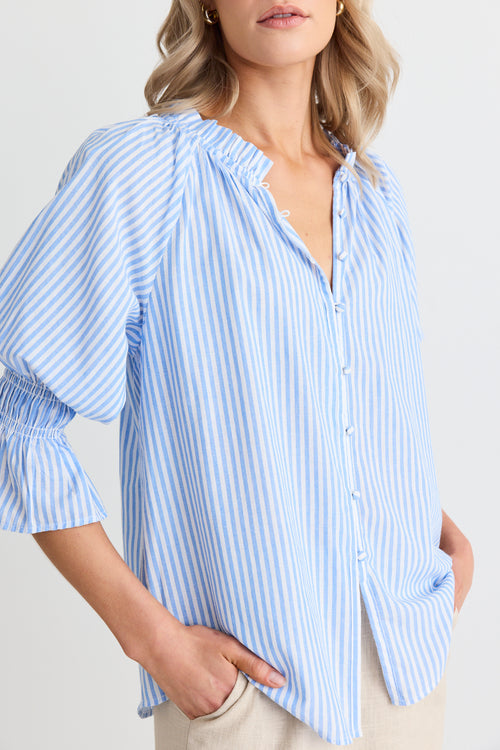 model wears a blue stripe blouse