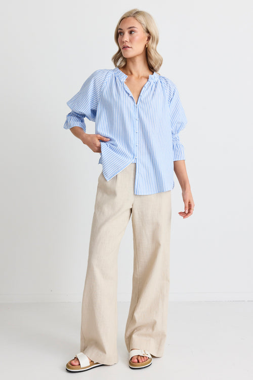 model wears a blue stripe blouse