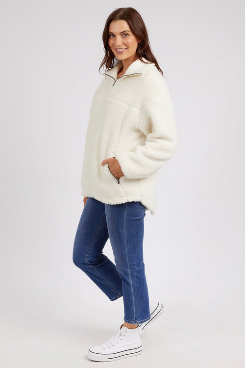 model wears a white jumper