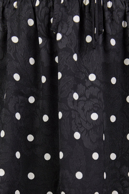 Black polka dot skirt with floral patterns