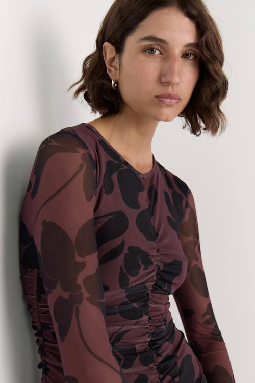 Model wears a mesh floral long sleeve maxi dress