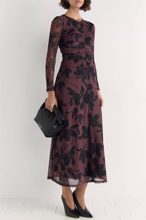 Model wears a mesh floral long sleeve maxi dress