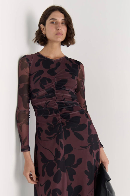 Model wears a mesh floral long sleeve maxi dress