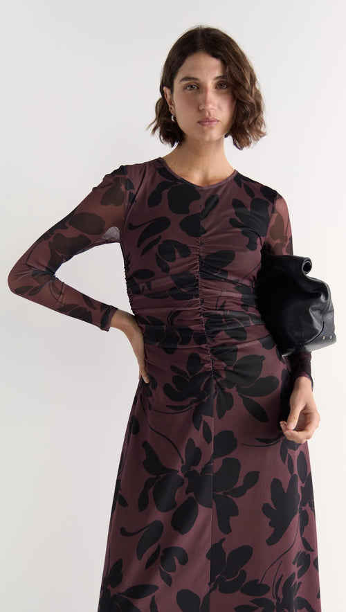 Model wears a mesh floral long sleeve maxi dress