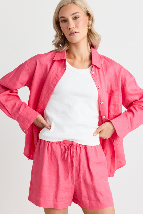 model wears pink shirt and pink shorts