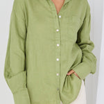 model wears green linen shirt