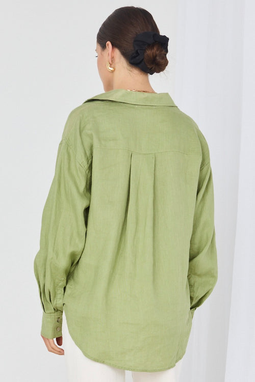 model wears green linen shirt