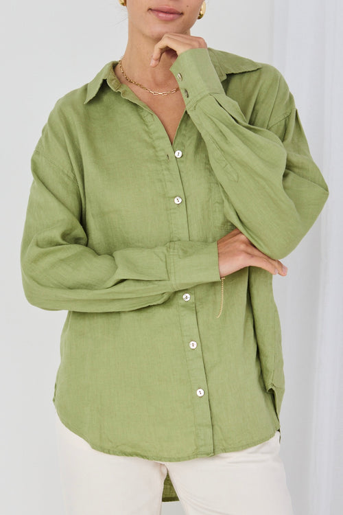 model wears green linen shirt