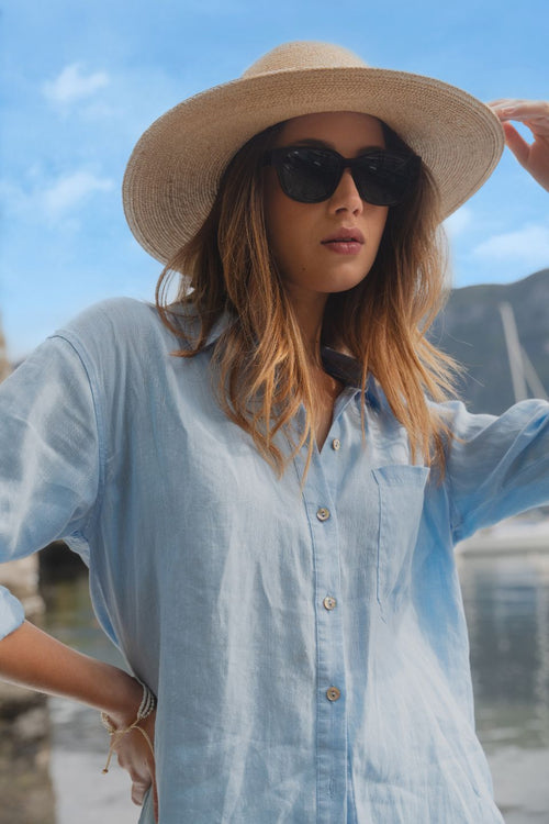 model wears blue oversized shirt