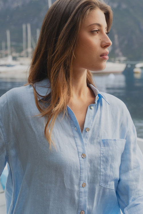 model wears blue oversized shirt