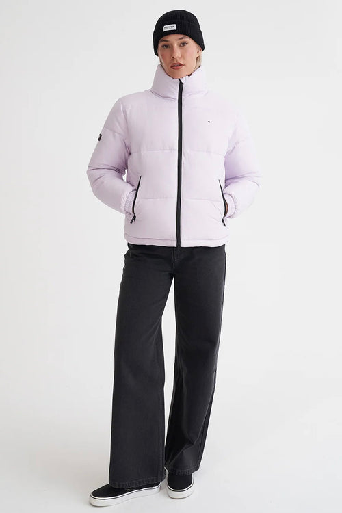 model wears a purple puffer jacket